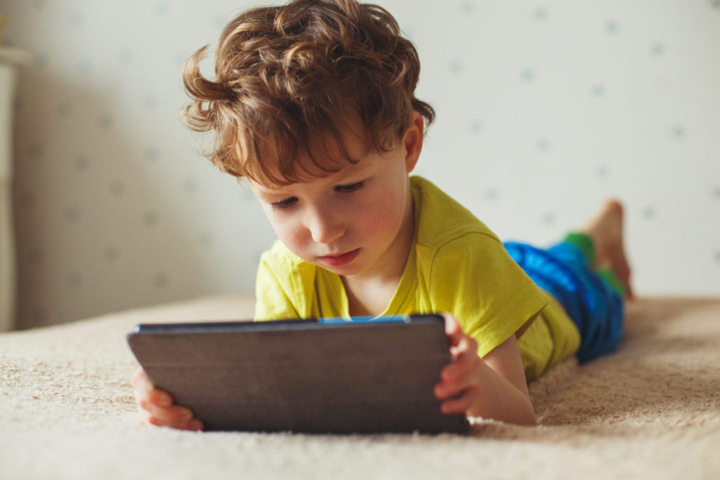 Cute,Little,Boy,Using,A,Pad.,Child,Playing,With,Digital